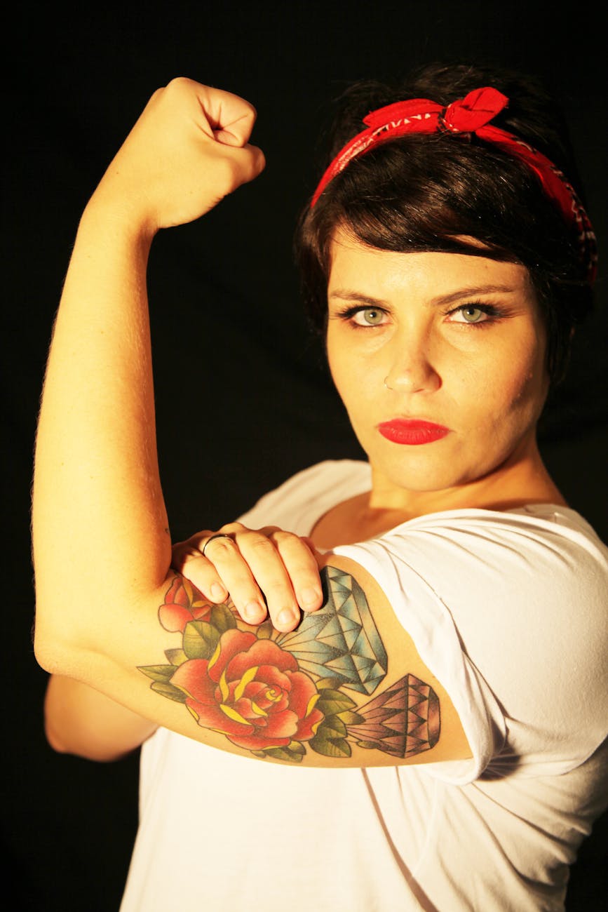 strong woman portrait with tattoo and bandana